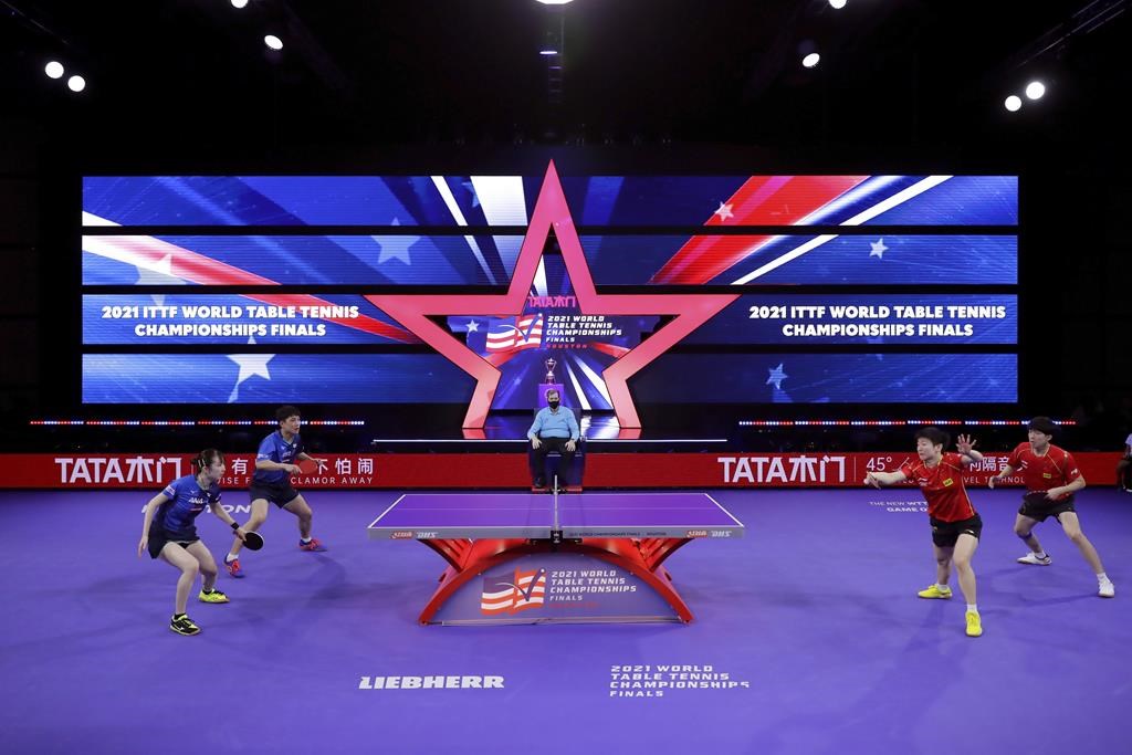 Japan's Hina Hayata and Tomokazu Harimoto,left, battle China's Chuqin Wang and Yingsha Sun, right, during the mixed doubles finals match during day six of the 2021 World Table Tennis Championships Sunday, Nov. 28, 2021, in Houston. The Canadian Table Tennis Championships scheduled for Sept. 22-24 in Hay River, N.W.T., have been cancelled due to the ongoing wildfire situation in the territory, Table Tennis North announced.