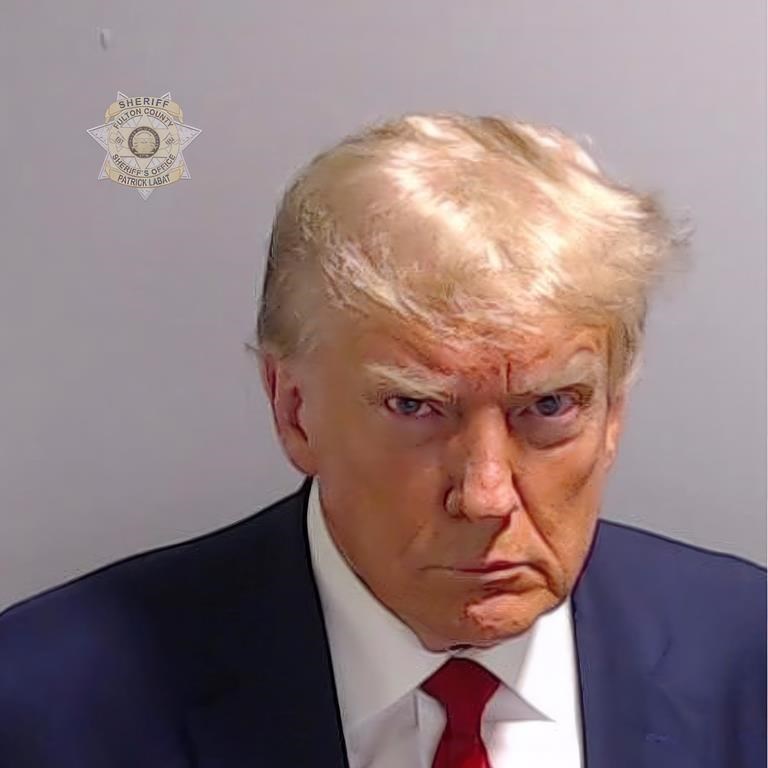 This booking photo provided by Fulton County Sheriff’s Office, shows former President Donald Trump on Thursday, Aug. 24, 2023, after he surrendered and was booked at the Fulton County Jail in Atlanta. Trump is accused by District Attorney Fani Willis of scheming to subvert the will of Georgia voters in a desperate bid to keep Joe Biden out of the White House. (Fulton County Sheriff’s Office via AP)