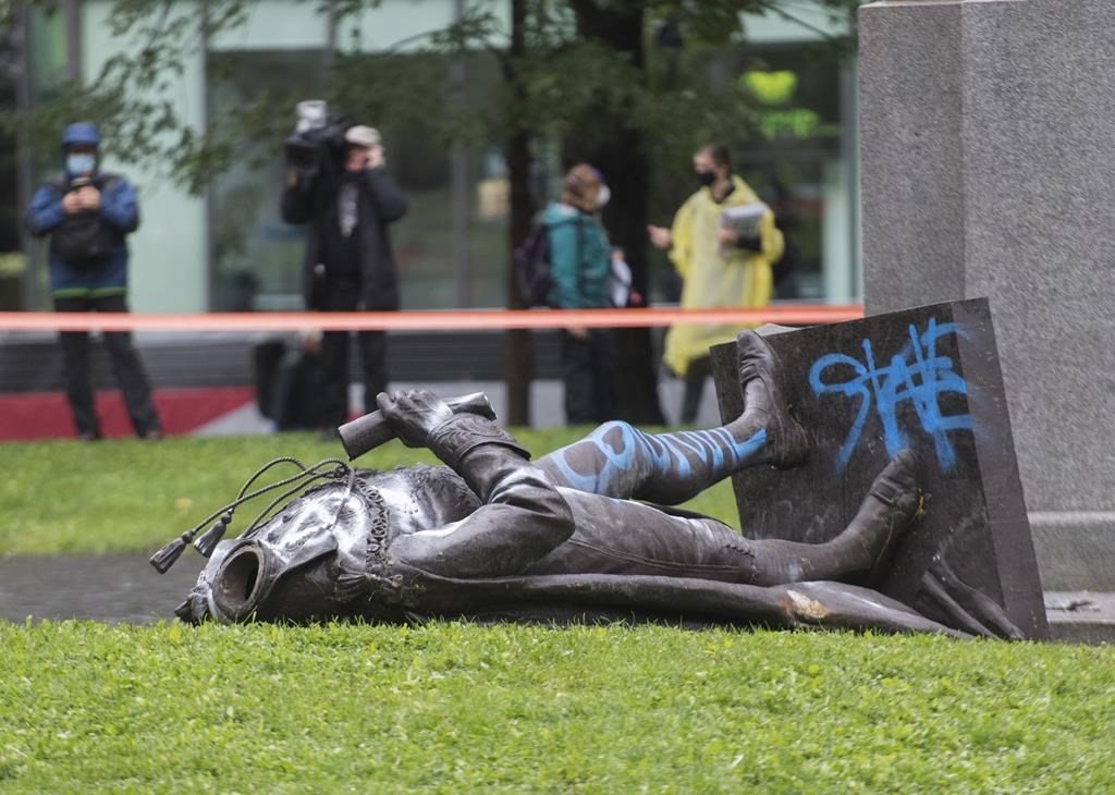 The statue of Sir John A. Macdonald is shown torn down following a demonstration in Montreal, Saturday, Aug. 29, 2020. Montreal does not intend to replace the toppled statue THE CANADIAN PRESS/Graham Hughes.