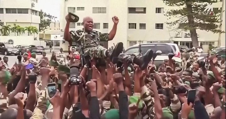 Gabon coup leader sworn in as interim president to cheering crowds