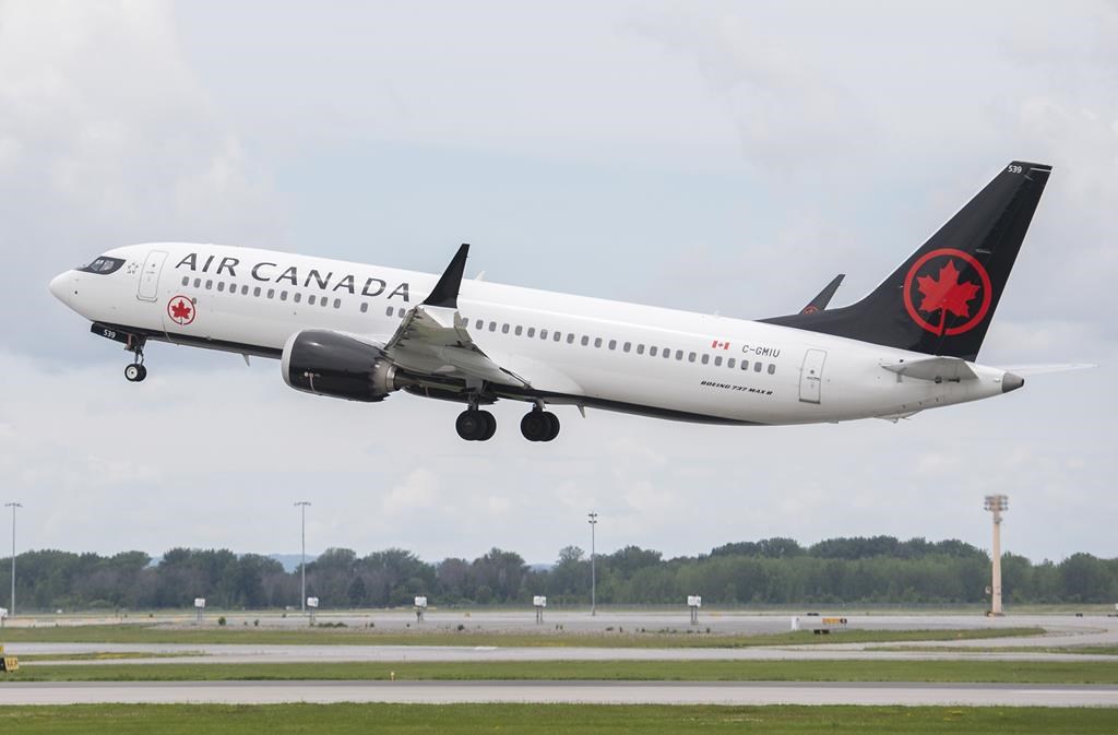 An Air Canada jet takes off from Trudeau Airport in Montreal on June 30, 2022.