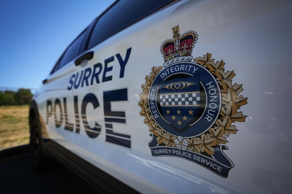 A Surrey Police crest is seen on the side of one of the force's vehicles in Surrey, B.C., on July 19, 2023.