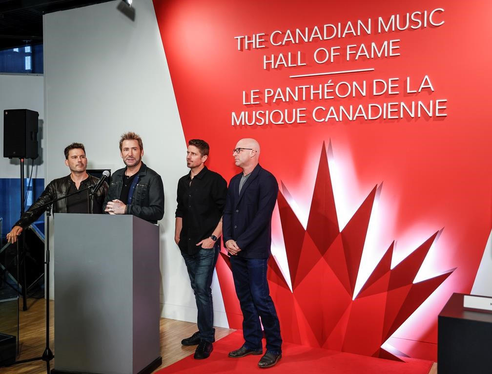Members of the band Nickelback, consisting of, left to right, Ryan Peake, Chad Kroeger, Daniel Adair and Mike Kroeger attend a Canadian Music Hall of Fame plaque ceremony in Calgary on Sunday, June 25, 2023. Canadian rockers Nickelback, South African rapper Sho Madjozi and Finn Wolfhard’s band The Aubreys are among the artists set to perform at the Toronto International Film Festival’s annual street party. THE CANADIAN PRESS/Jeff McIntosh.
