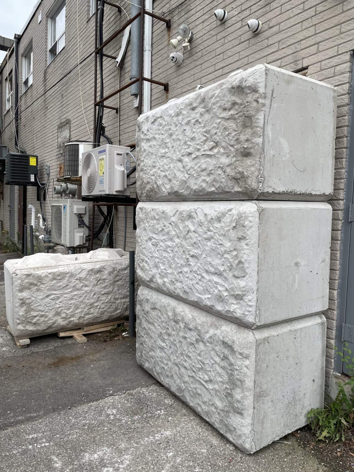 Concrete barricade at the back of Weed Releaf Cannabis.