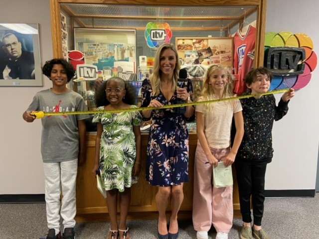 Carole Anne Devaney with our 2023 reporters for the day (left to right): 12-year-old Aaryan, 12-year-old Olivia, 10-year-old Cecily and 12-year-old Hudson at Global Edmonton on Wednesday, August 23, 2023.
