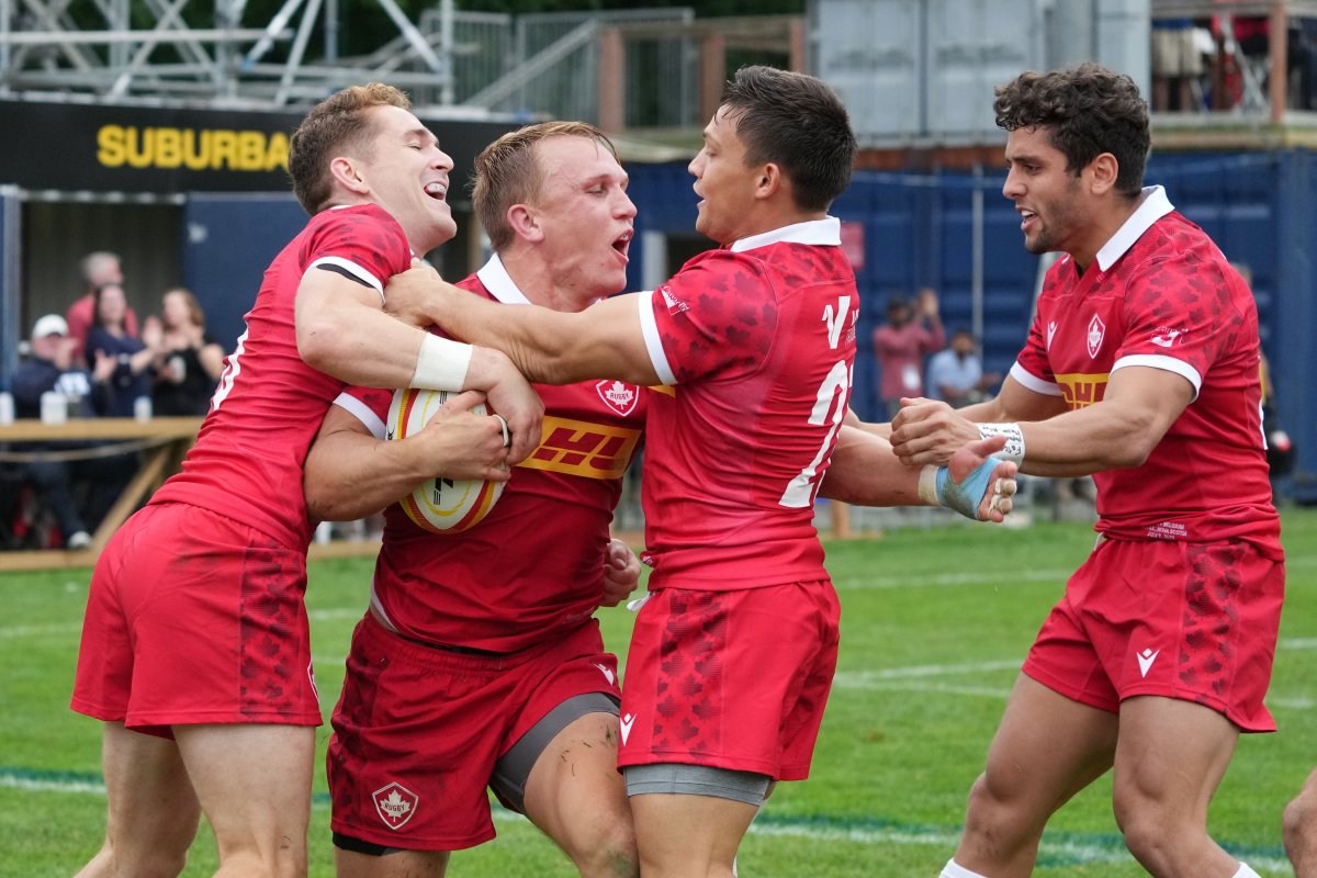 Canada's Ben LeSage, second from left, celebrates scoring a try with teammates, from left to right, Cooper Coats, Ross Braude, and Dawson Fatoric during the second half of a men's 15s international rugby test match against Belgium in Halifax on Saturday, July 2, 2022.
