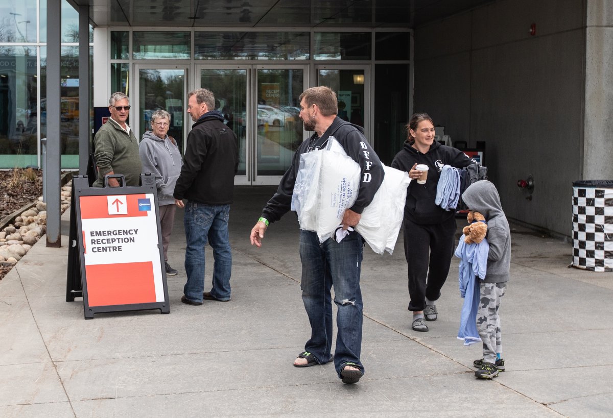 Wildfire evacuees get supplies and get checked in at the evacuation centre in Edmonton, Sunday, May 7, 2023. Many Albertans are pitching in to help the thousands of people who have been displaced by wildfires in recent weeks.