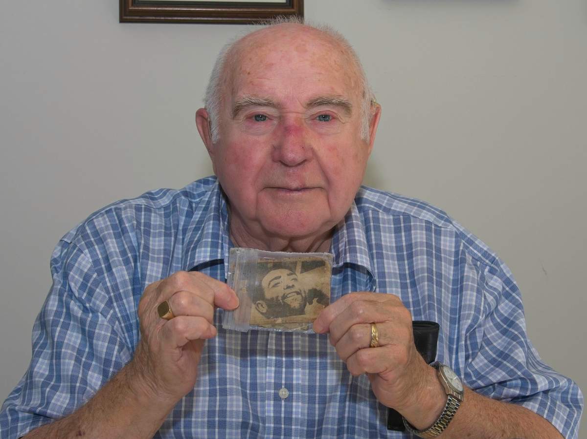 Former Springhill miner Harold Brine poses in his home near Fredericton in an October 2018 handout photo. He was the last survivor among two groups of men who made headlines around the world in 1958 when they were miraculously rescued several days after the three lowest levels of the mine clamped shut, killing 75 of the 174 miners working that night. The photo Brine is holding was taken in the hospital in Springhill, N.S., after his rescue and he carried it in his wallet ever since then. 