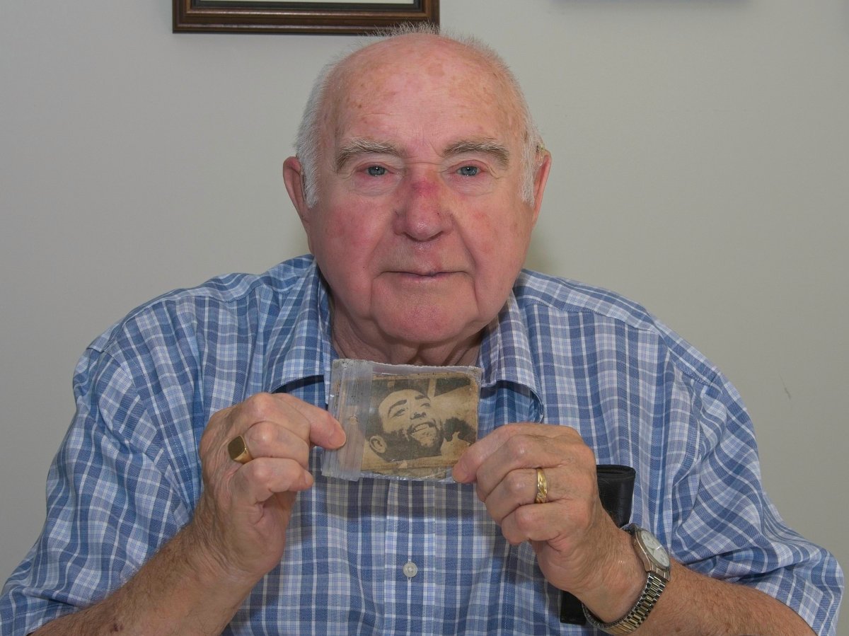 Former Springhill miner Harold Brine poses in his home near Fredericton in an October 2018 handout photo. He was the last survivor among two groups of men who made headlines around the world in 1958 when they were miraculously rescued several days after the three lowest levels of the mine clamped shut, killing 75 of the 174 miners working that night. The photo Brine is holding was taken in the hospital in Springhill, N.S., after his rescue and he carried it in his wallet ever since then. 