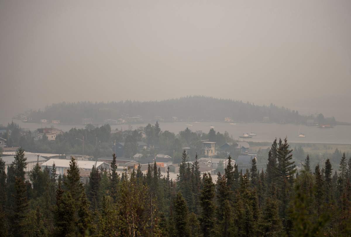 Heavy smoke from nearby wildfires fills the sky in Yellowknife on Tuesday, August 15, 2023.
