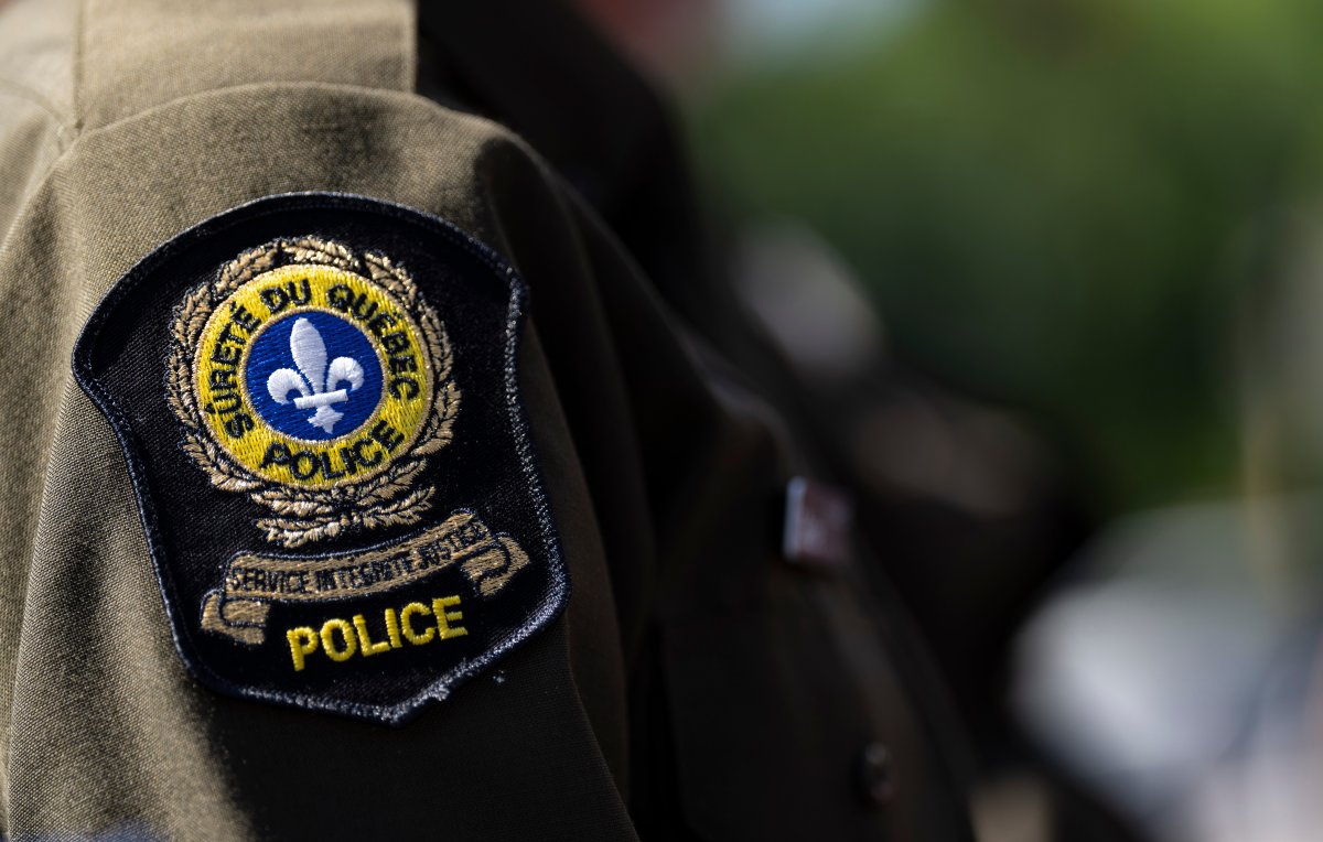 A Sûreté du Québec emblem is seen on an officer’s uniform in Montreal, Tuesday, Aug. 22, 2023. Quebec provincial police say three people are dead after a fishing boat sunk off the province's Lower North Shore.
