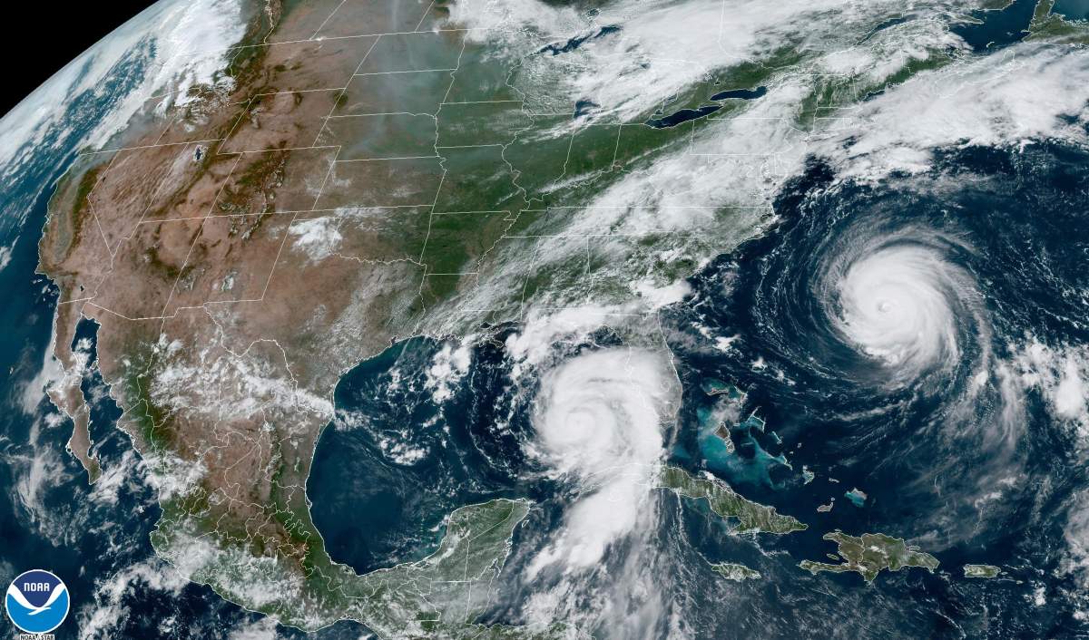 This Tuesday, Aug. 29, 2023, 1:31 p.m. EDT satellite image provided by the National Oceanic and Atmospheric Administration shows Hurricane Idalia, center, approaching Florida’s Gulf Coast, and Hurricane Franklin, right, as it moves along the East coast of the United States, southwest of Bermuda. (NOAA via AP)