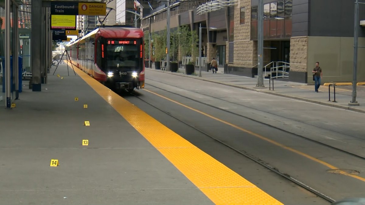 Evidence markers along the Eighth Street CTrain station in downtown Calgary following a suspected stabbing in August 2023.