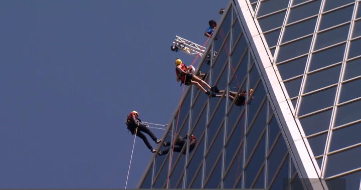 Charity fundraisers take ‘leap of faith’ from Regina’s tallest building