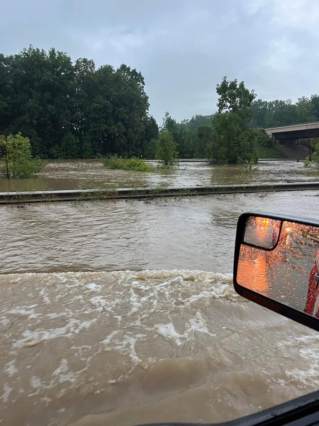 A photo taken by Warwick Fire and Rescue shows the road flooding caused by heavy rain Wednesday.