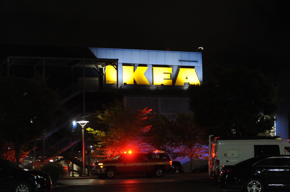 An Ikea store with police lights in front. It is nighttime.