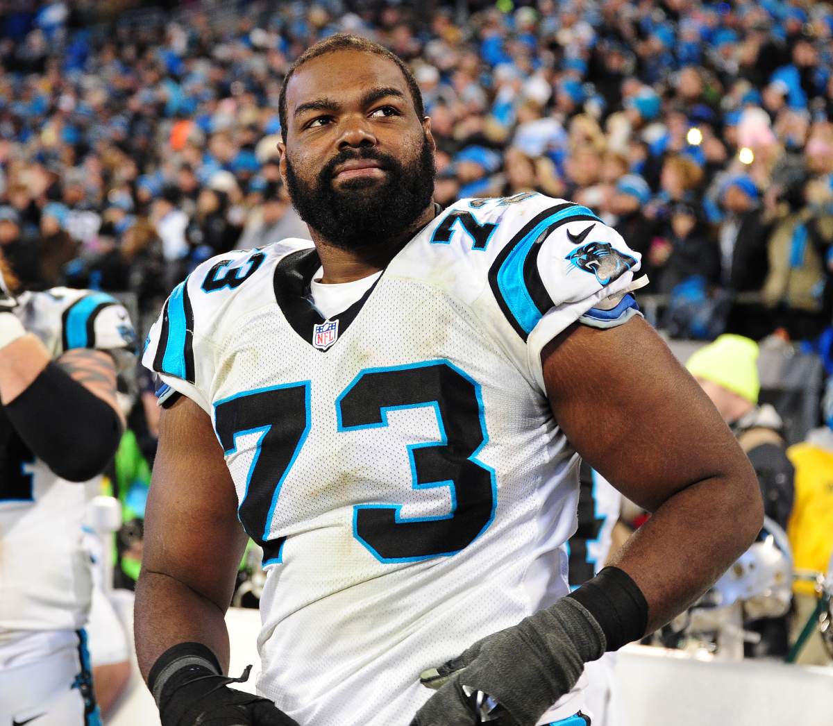 Michael Oher #73 of the Carolina Panthers watches play against the Arizona Cardinals during the NFC Championship Game at Bank Of America Stadium on January 24, 2016 in Charlotte, North Carolina.