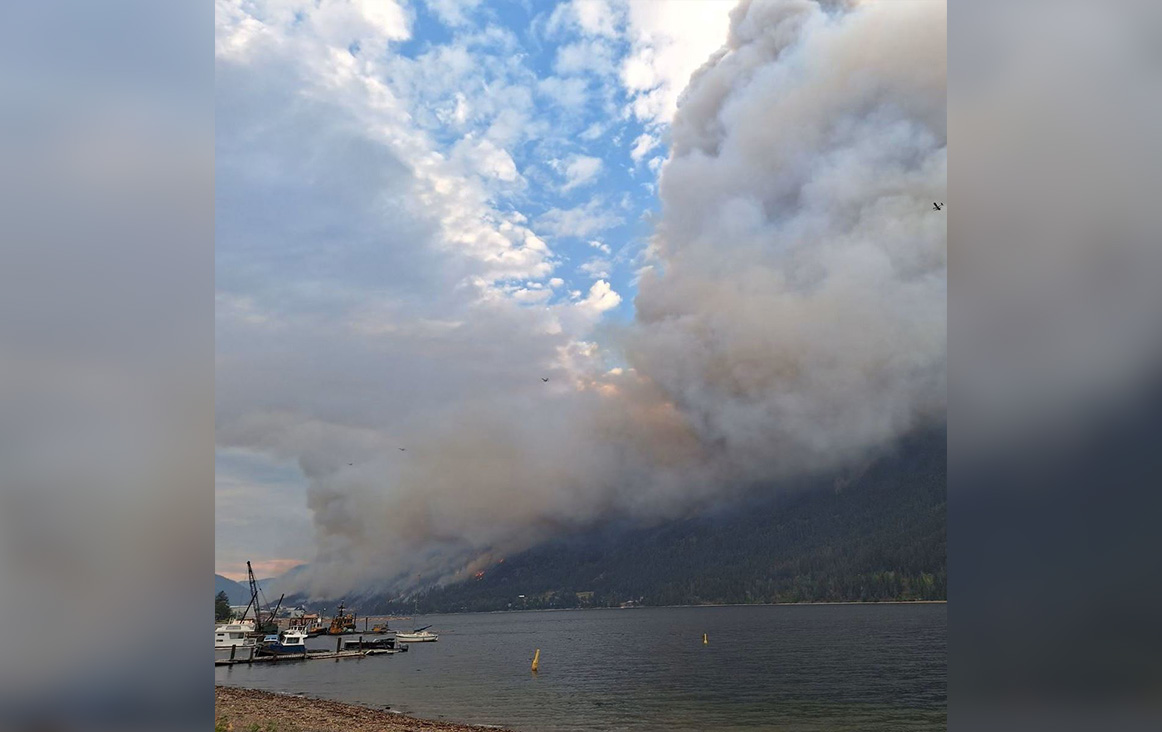 Smoke rises from the Lower East Adams Lake wildfire on Wednesday, Aug. 2, 2023.