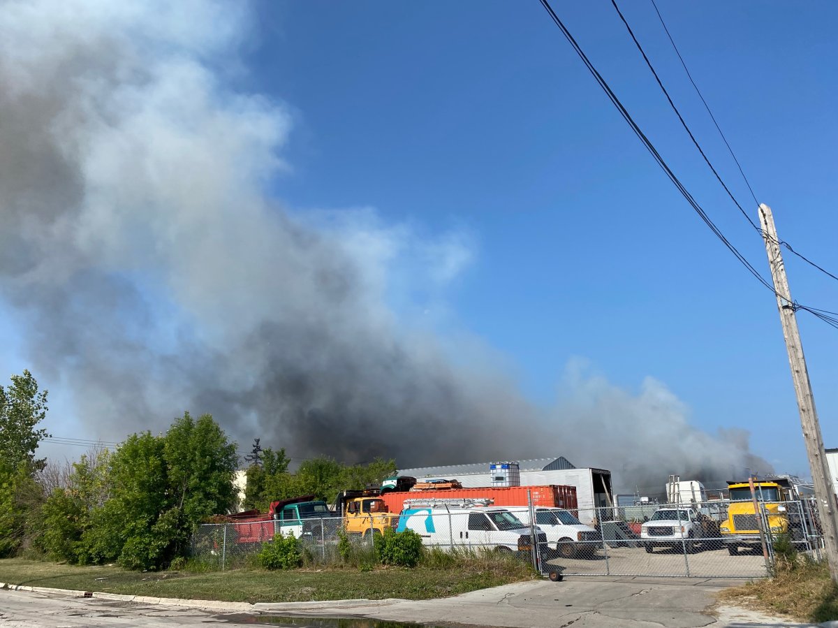 A massive fire in a commercial building prompted the evacuation of several homes and closed down a section of Logan Ave on Sunday. .