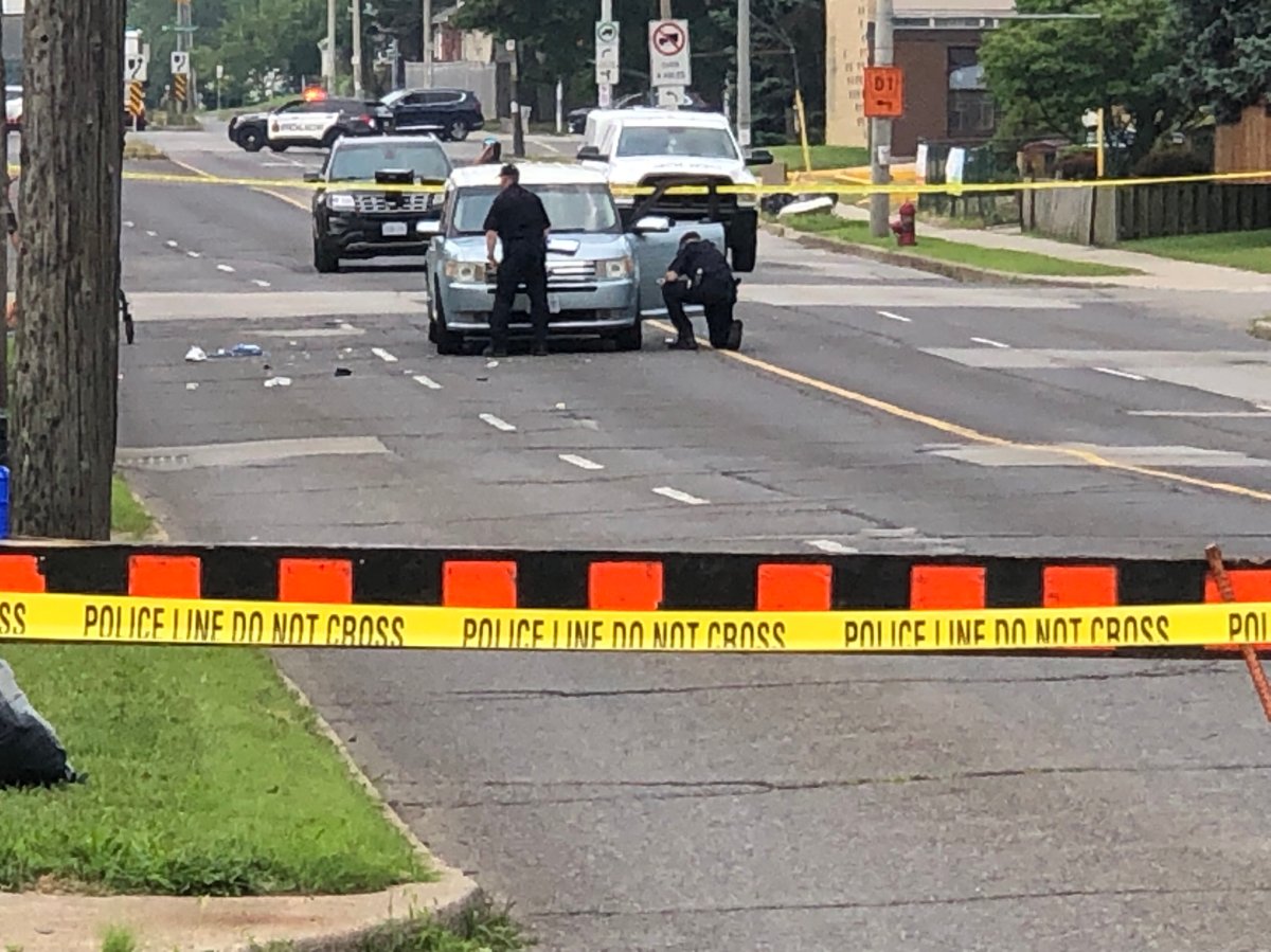 Collision reconstruction investigators at the scene at Fennell Avenue just west of Upper Wellington Street in Hamilton on July 25, 2023.