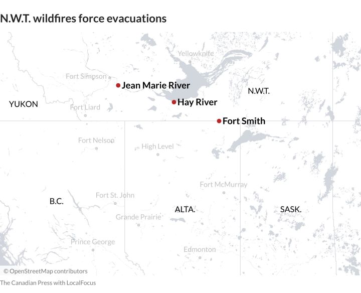 Wildfires burning near the border between Alberta and the Northwest Territories have prompted evacuations.