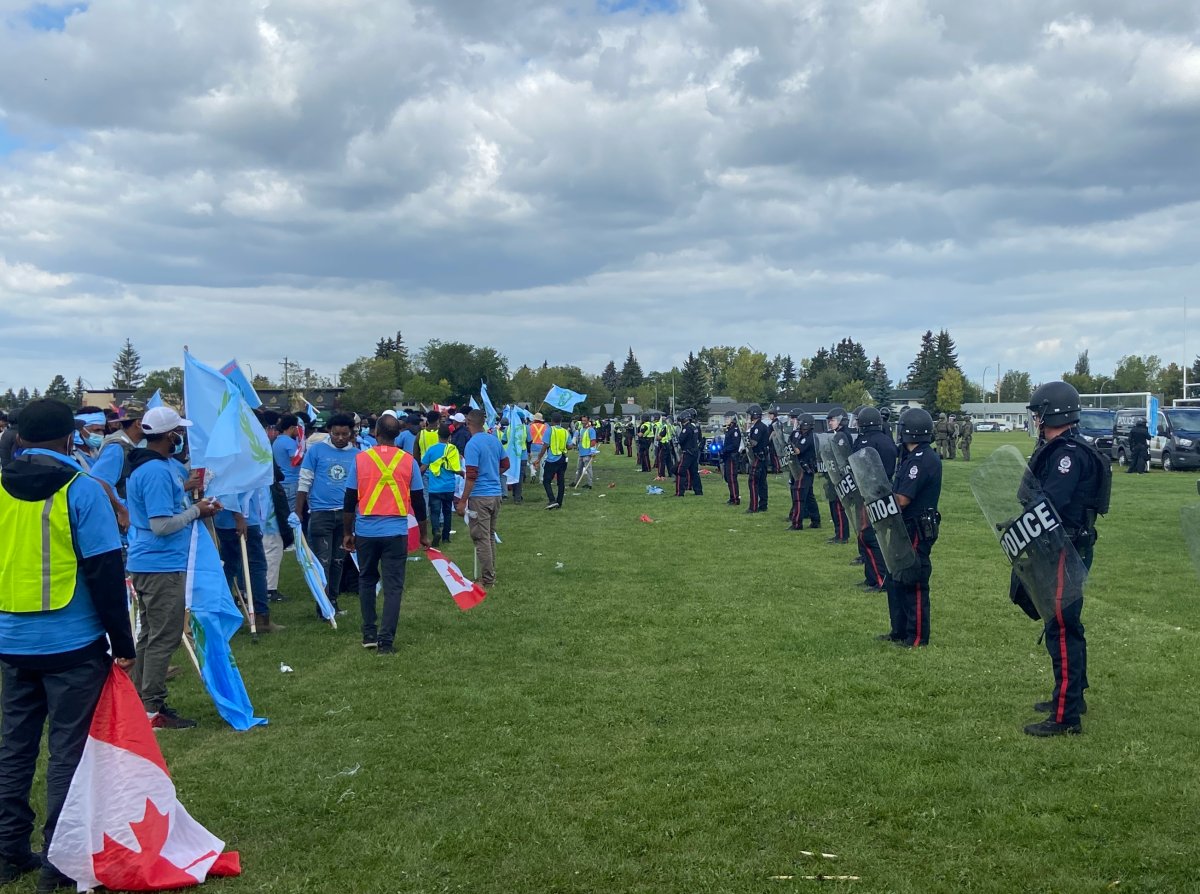 A heavy Edmonton Police Service presence breaking up a fight between anti-Eritrea protesters and Eritrean Festival organizers at an event in north Edmonton on Saturday, August 19, 2023.