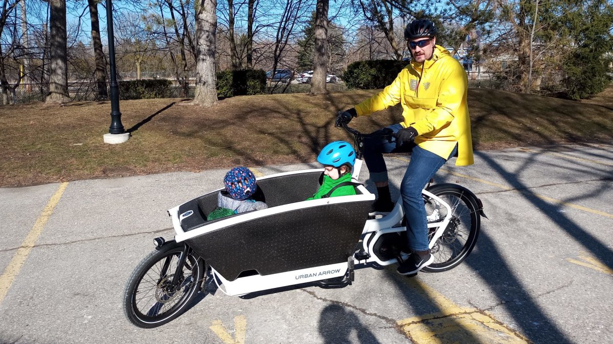 Guelph, Ont. residents Cam Ogilvie and sons in the family electric cargo bike which replaced a car they rarely used.