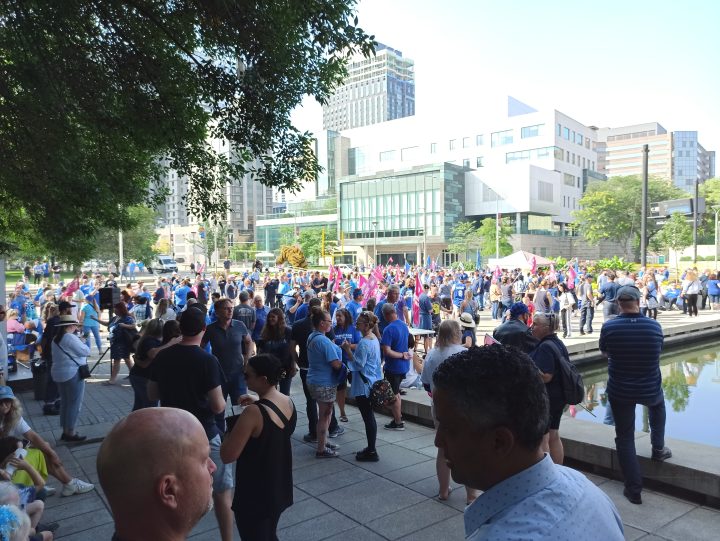 Hamilton workers rally in the city hall forecourt on Aug. 16, 2023 with just days remaining in a strike deadline.