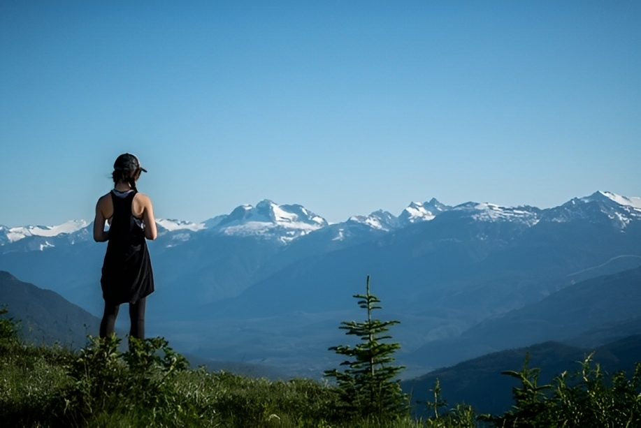 Michelle Schiewe, seen here in the mountains near Revelstoke, B.C., says she’s being forced to leave the small resort city for Saskatchewan due to the rising cost of living.