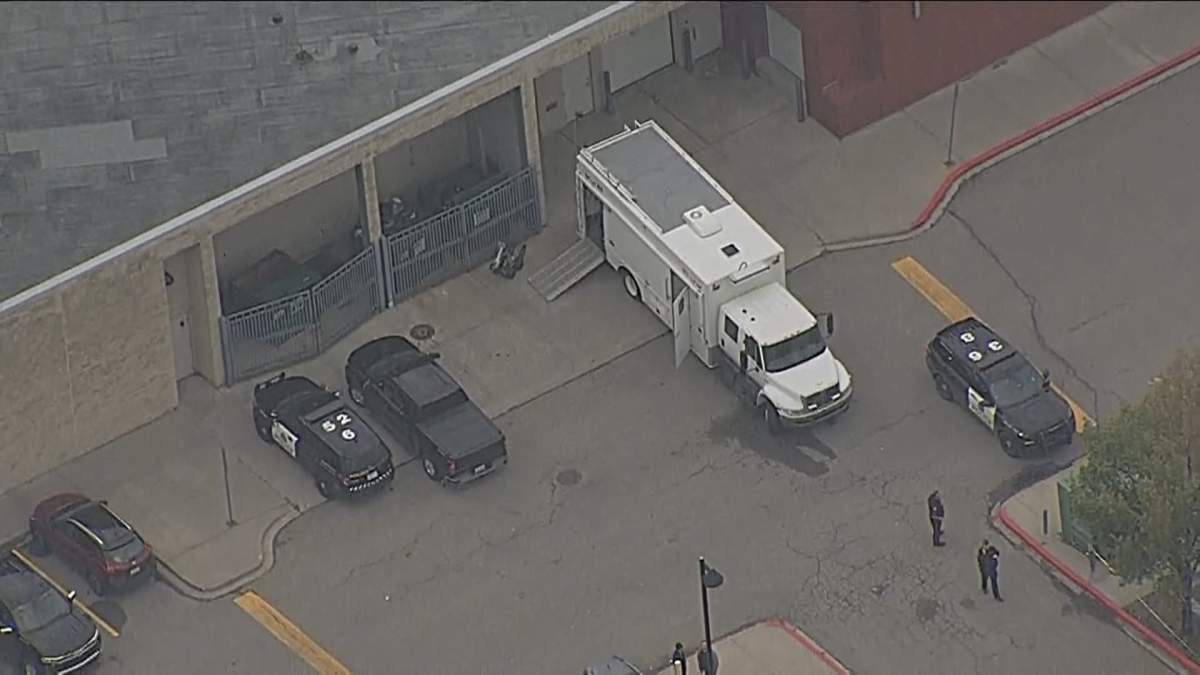 Calgary Police Service members outside of Bishop O'Byrne High School in southeast Calgary during an Aug. 31 investigation that prompted the temporary closure of the school.
