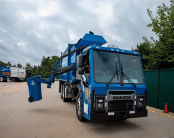 Automated garbage trucks are equipped with a mechanical arm to lift standardized bins from the curb.