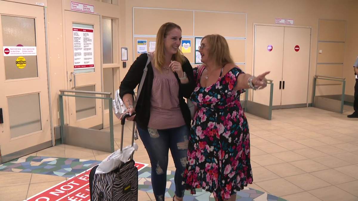 Heather Cintron and Denise Wildeman meeting at the Edmonton International Airport on Tuesday, Aug. 1, 2023.