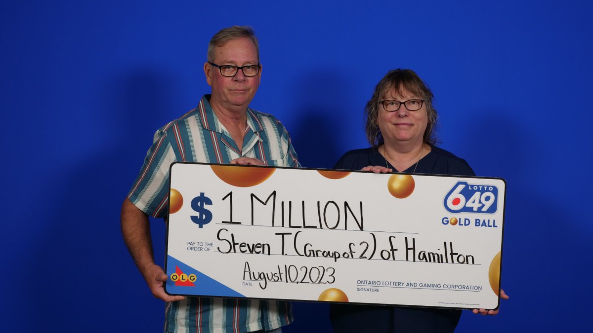 Gold Ball lotto winners Steven Taylor and Patti-Sue Cushenan of Hamilton pictured after picking up a LOTTO 6/49 prize worth $1 million.