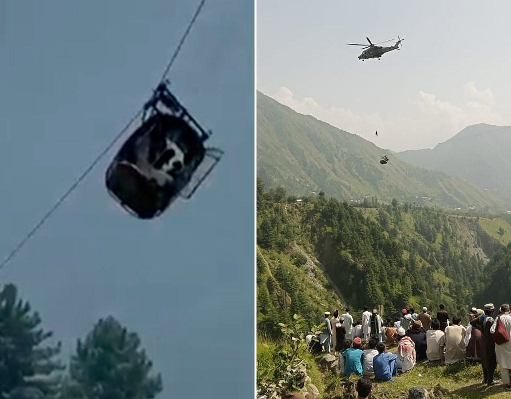 A cable car carrying six children and two adults dangles hundreds of metres above the ground in the remote Battagram district, Khyber Pakhtunkhwa, Pakistan on Tuesday, Aug. 22, 2023. Military commandos attempted to reach the cable car by descending from robes from a helicopter.