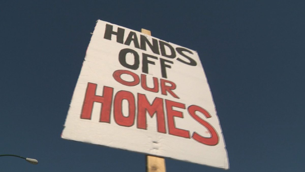 Residents of an apartment building on Glen Drive held a rally Tuesday morning to protest the landlord evicting one of the tenants.