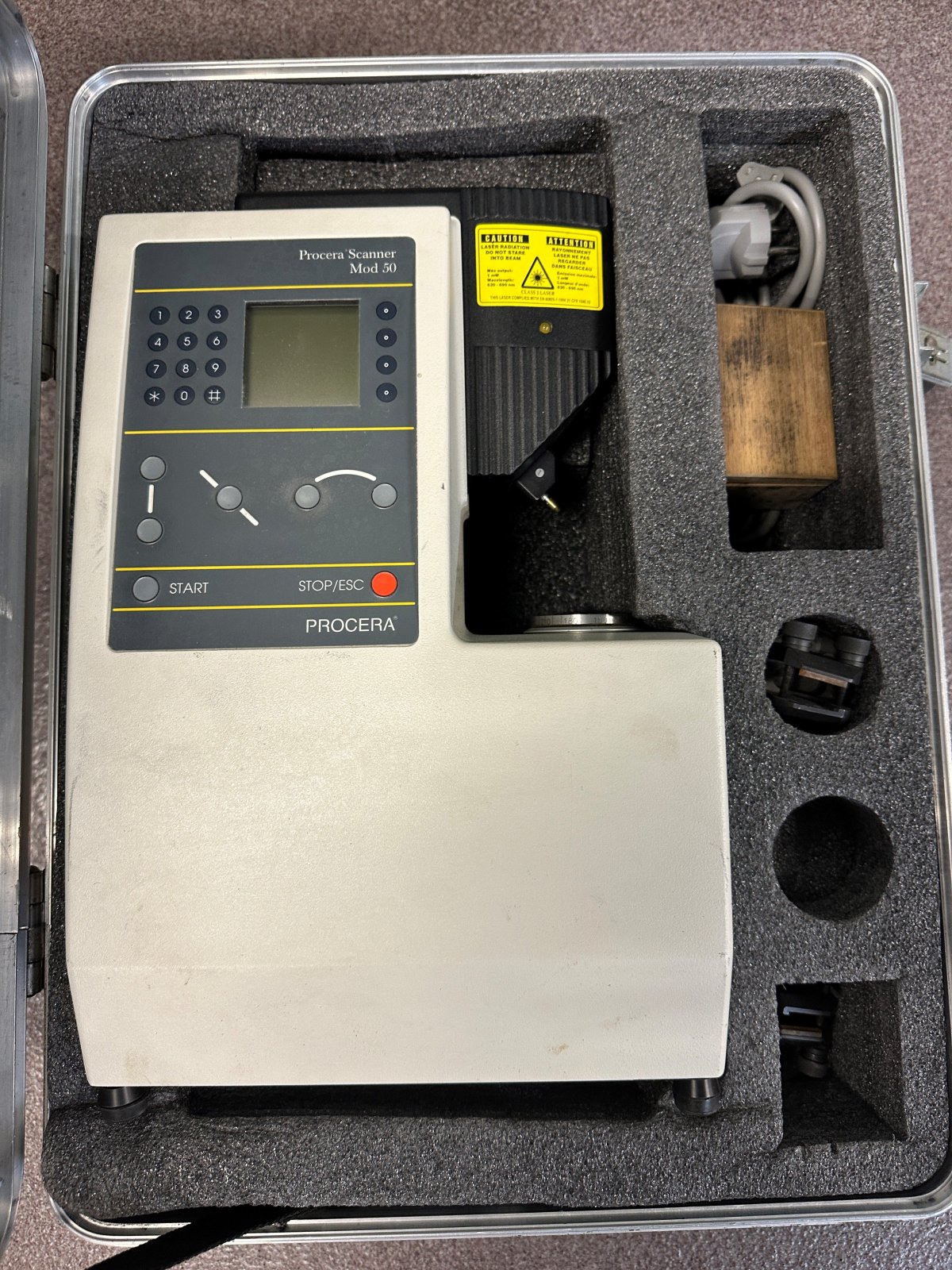 During a search of the vehicle, a piece of specialty equipment, a "Procera Scanner Mod 50" in a large carrying case was found. Further investigation into the scanner indicates that it holds significant value and is used in the dental industry, however it’s origin remains unknown.