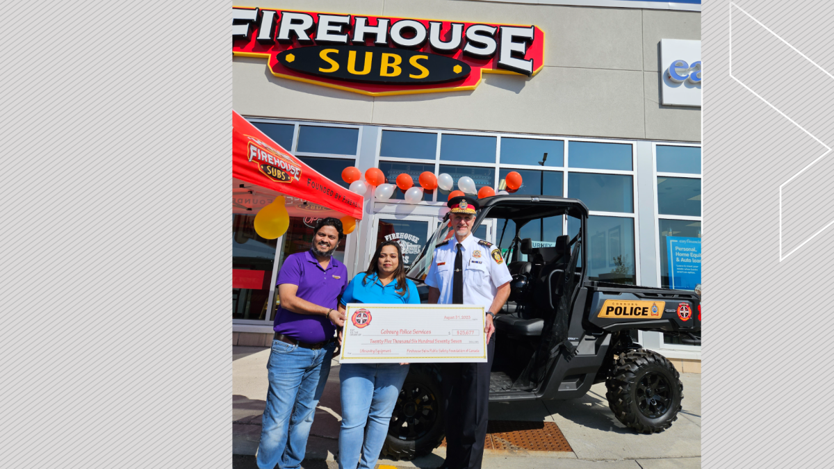 Firehouse Subs Cobourg's Aadipkumar Pandya and Privanti Patel present the cheque to Cobourg Police Serivce Chief Paul VandeGraaf on Aug. 31, 2023, for the purchase of an UTV for the service's fleet.