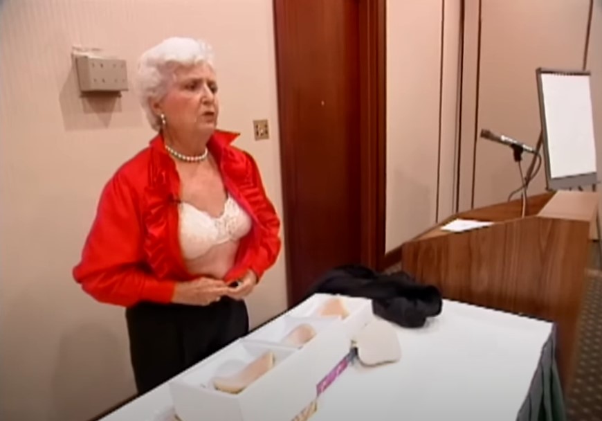 Ruth Handler demonstrates her breast prosthesis in this screengrab from an interview with CBS.