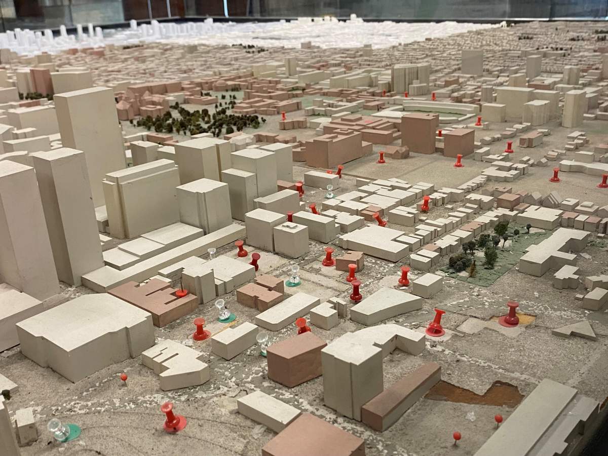 Red thumbtacks represent every new building that has been constructed since the model was built.