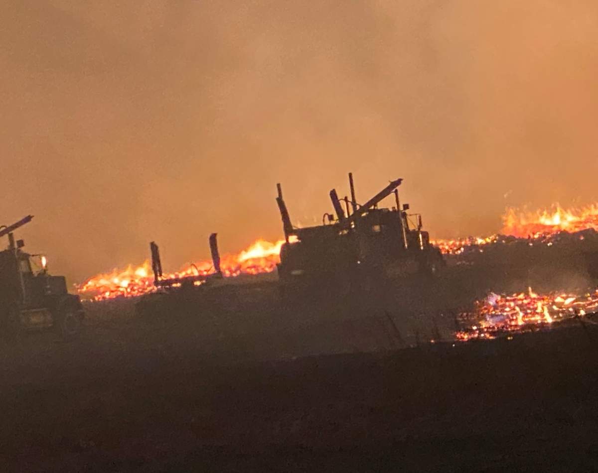 The firewood processing operation near Hay River, N.W.T., up in flames August 2023.