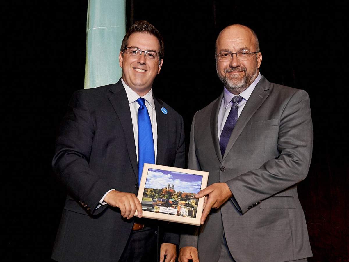 Mayor Cam Guthrie presenting award to recipient John Dennis in 2018.