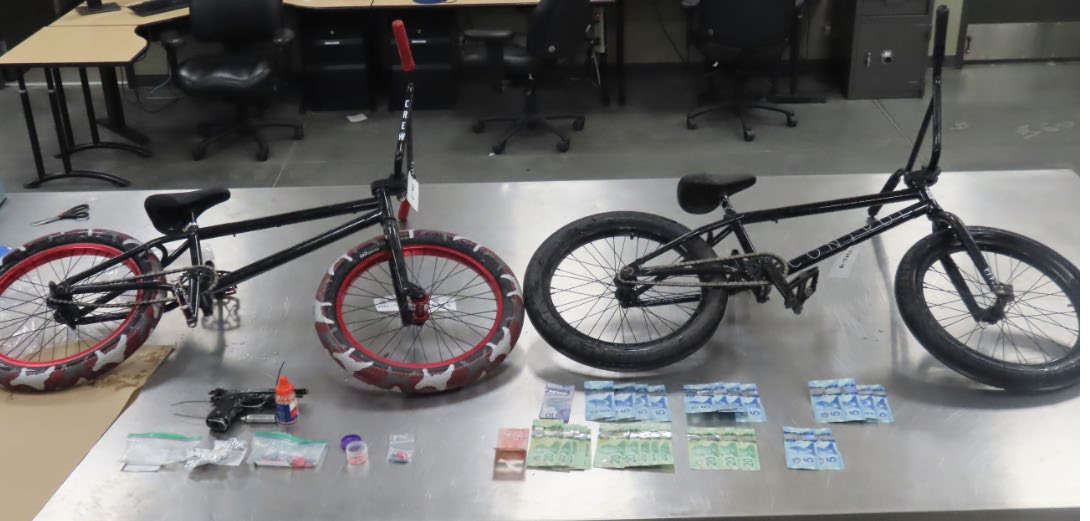 The collection of drugs, weapons and other items Calgary police seized during an Aug. 31 search warrant issued for a motel room.
