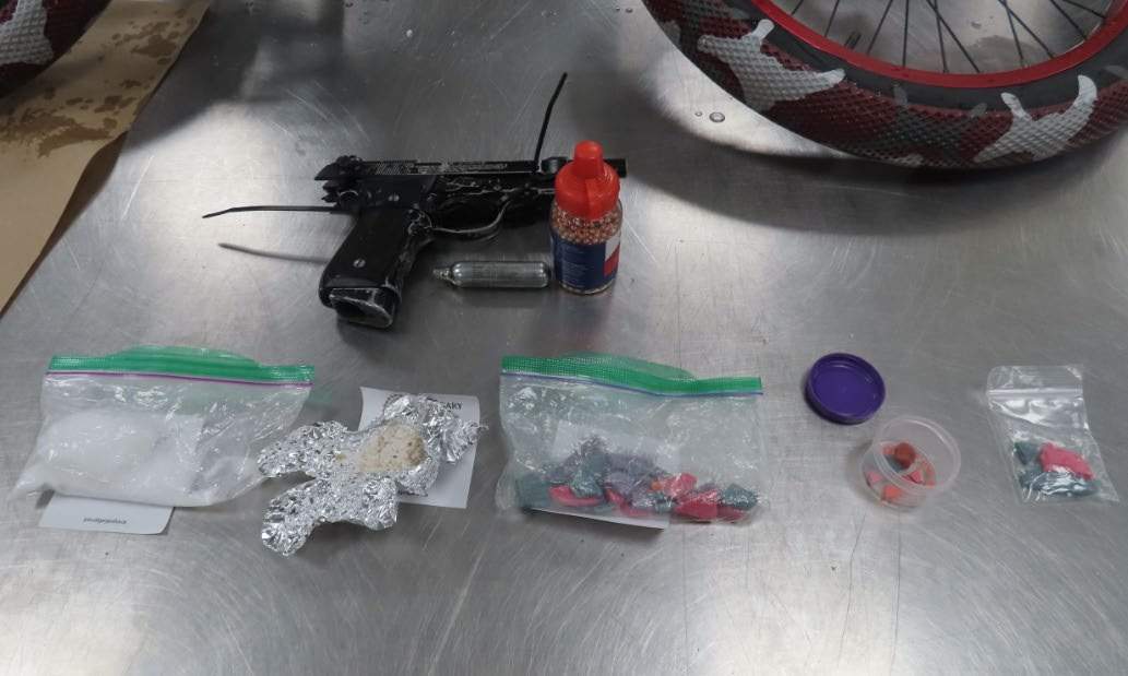 The collection of drugs, weapons and other items Calgary police seized during an Aug. 31 search warrant issued for a motel room.