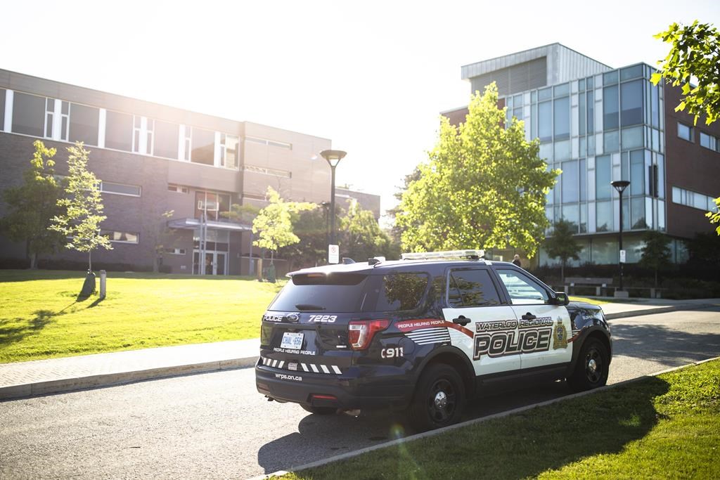 A Waterloo Regional Police vehicle is seen at the scene of a stabbing at the University of Waterloo, in Waterloo, Ont., Wednesday, June 28, 2023. Federal prosecutors say the charges against a man accused of a triple stabbing targeting a gender studies class at the University of Waterloo amount to terrorism offences. 