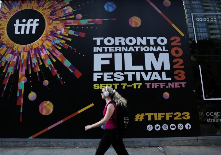 A woman walks along the closed-off streets at the Toronto International Film Festival, in Toronto, Thursday, Sept. 7, 2023. Hollywood A-listers Mark Ruffalo and Rachel McAdams are among 200-plus film industry workers around the world who signed an open letter imploring the Toronto International Film Festival to end ties with sponsor, the Royal Bank of Canada. 