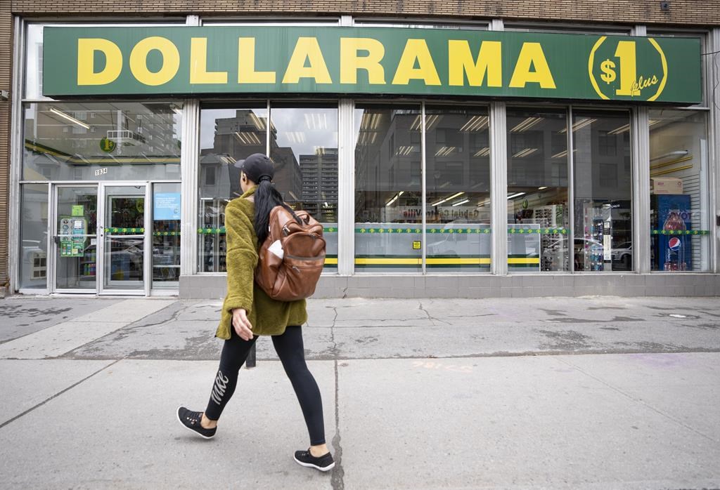 Dollarama Inc. reported its second-quarter profit rose compared with a year ago as it sales also climbed nearly 20 per cent. A person walks past a Dollarama store in Montreal, Wednesday, June 7, 2023.
