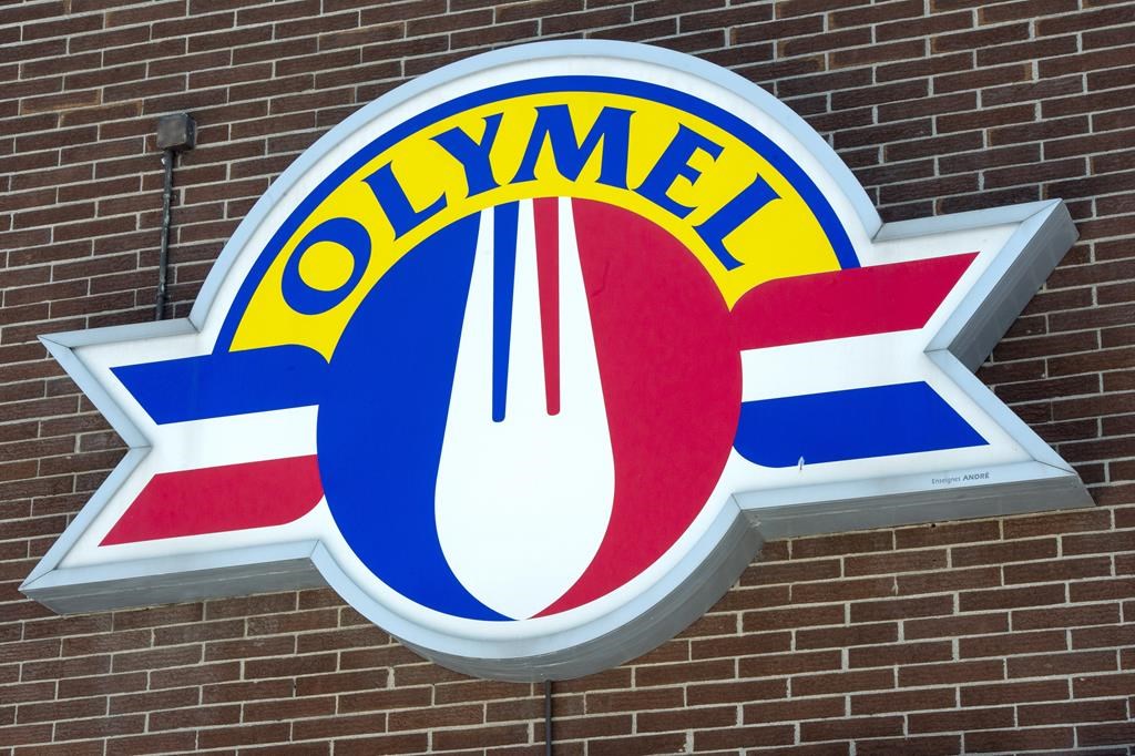 An Olymel sign is shown in Montreal on Tuesday, March 24, 2020, in Montreal. Olymel is closing two plants in Quebec and Ontario and accelerating the closure of another, affecting around 400 employees as the company says it's still facing market challenges.