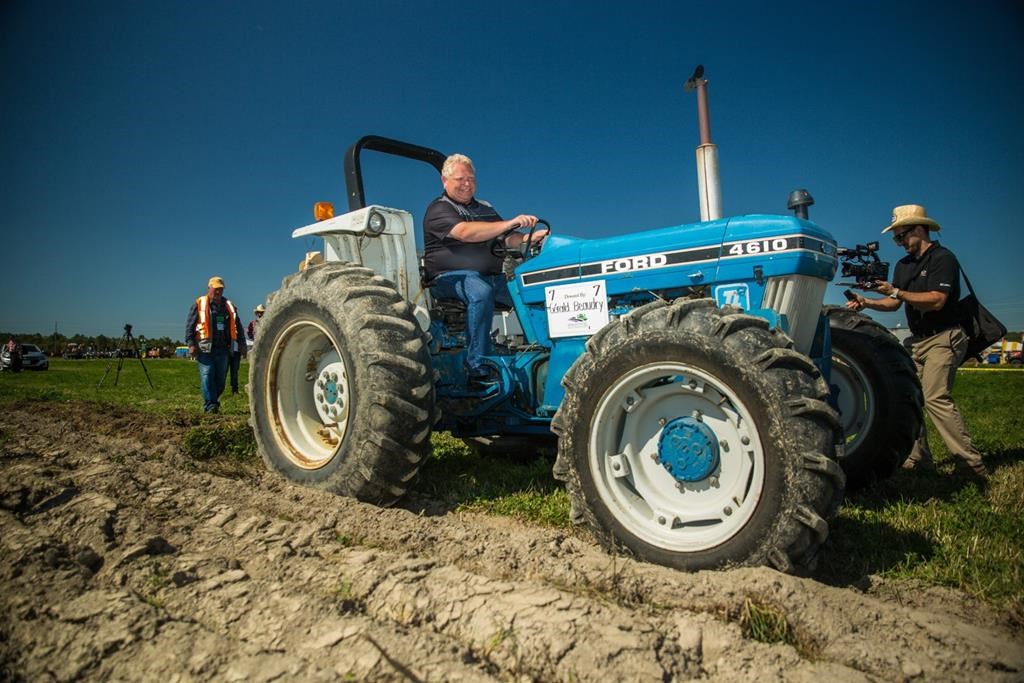 Ontario Premier Doug Ford plows a furrow at the International Plowing Match in Verner, Ont. on Tuesday, September 17, 2019. Ontario politicians of all stripes, including Ford, are set to make an annual trek to the International Plowing Match today. THE CANADIAN PRESS/Vanessa Tignanelli.