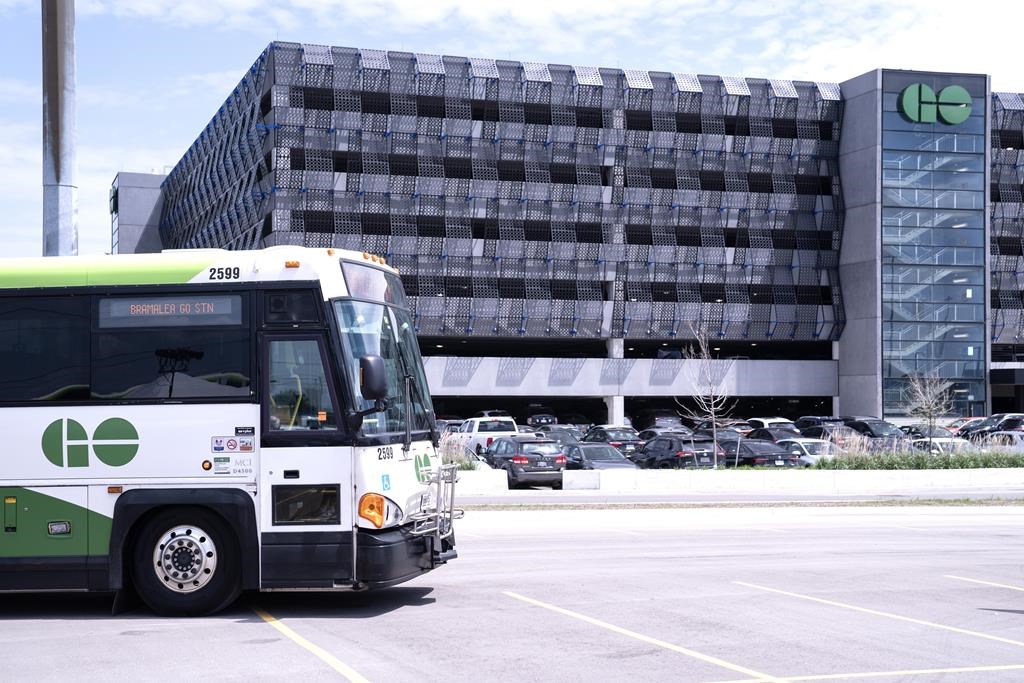 A bus is seen outside the parking lot at the Bramalea GO Station, in Brampton, on Thursday May 11, 2023. Ontario's minister of infrastructure is proposing a new way of funding GO Transit stations that she says will both increase transit service and housing nearby.