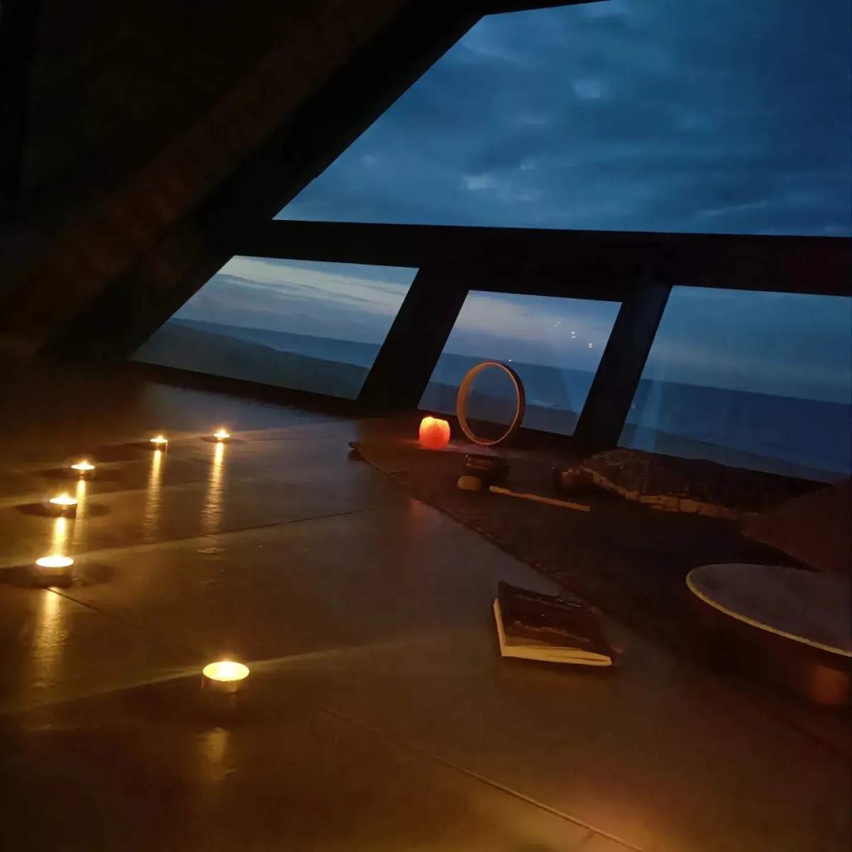 Photo of candles lit inside a room in the North Sea Observatory, where a couple of bystanders called in what they thought was a ritual mass murder happening.